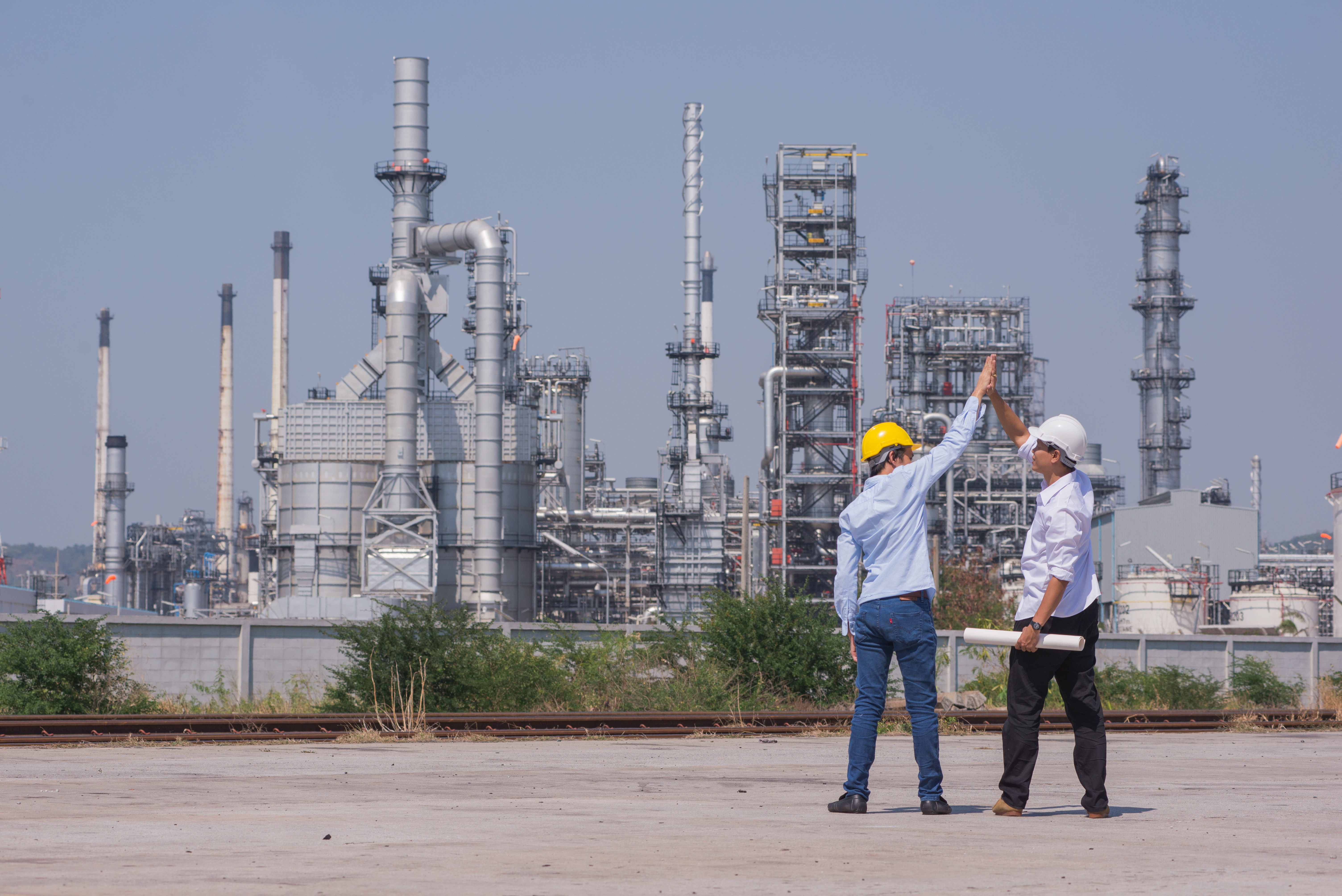 High five at the oil refinery